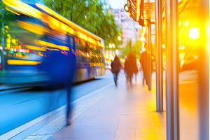 Blurred city street scene with bus, a Transportation Photo by Lermont51