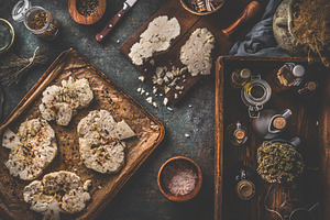 Cauliflower steaks on baking sheet