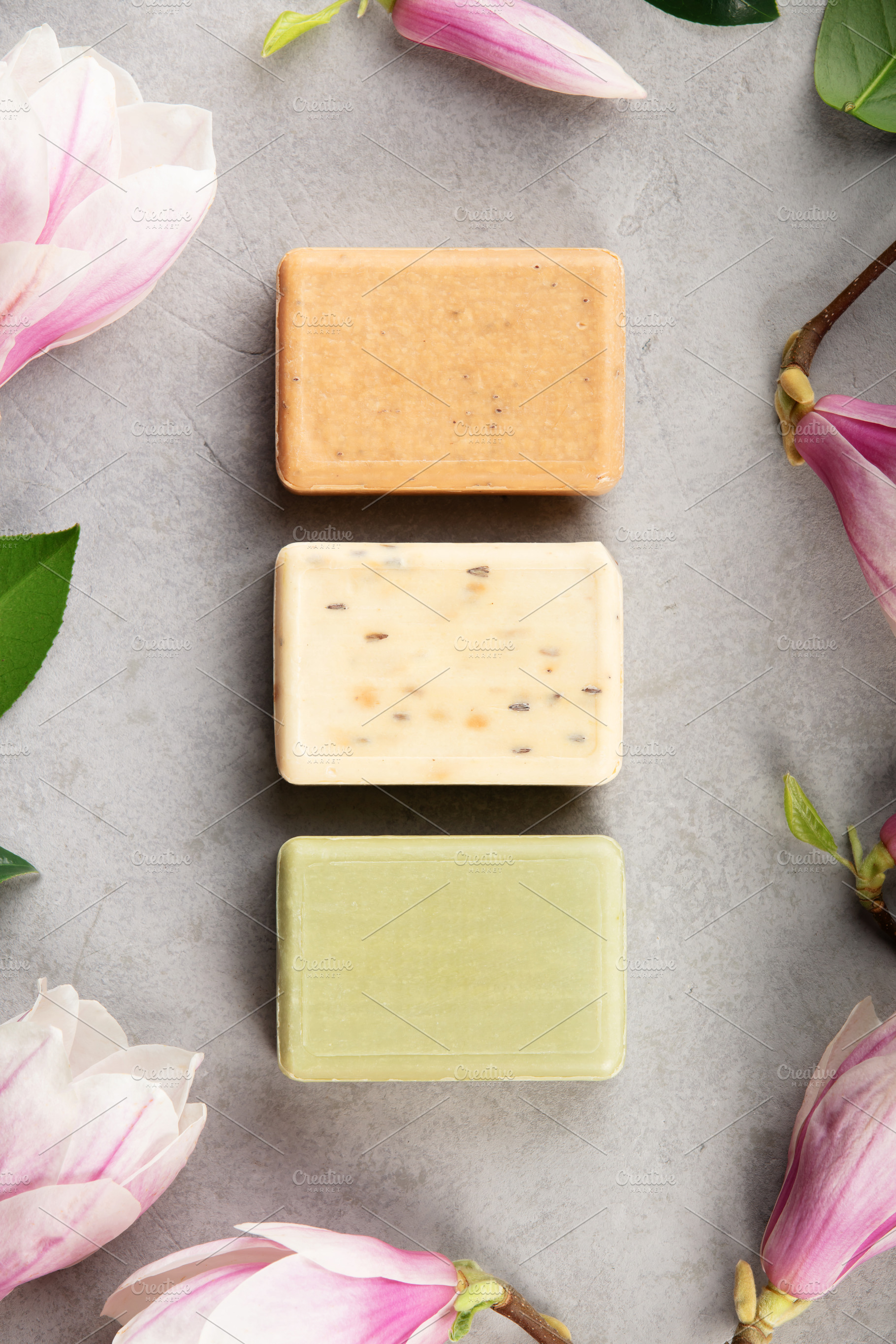 Natural Handmade Soap Bars with Flowers on Gray Background, a Health & Medical Photo by Natalia Klenova's Shop