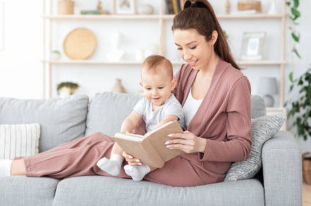 Best Baby Books. Loving Mom Reading, a Background Photo by Prostock-Studio