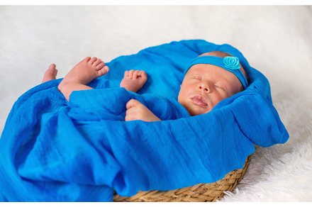 Newborn baby sleeping on a blue, a Person Photo by yanadjana