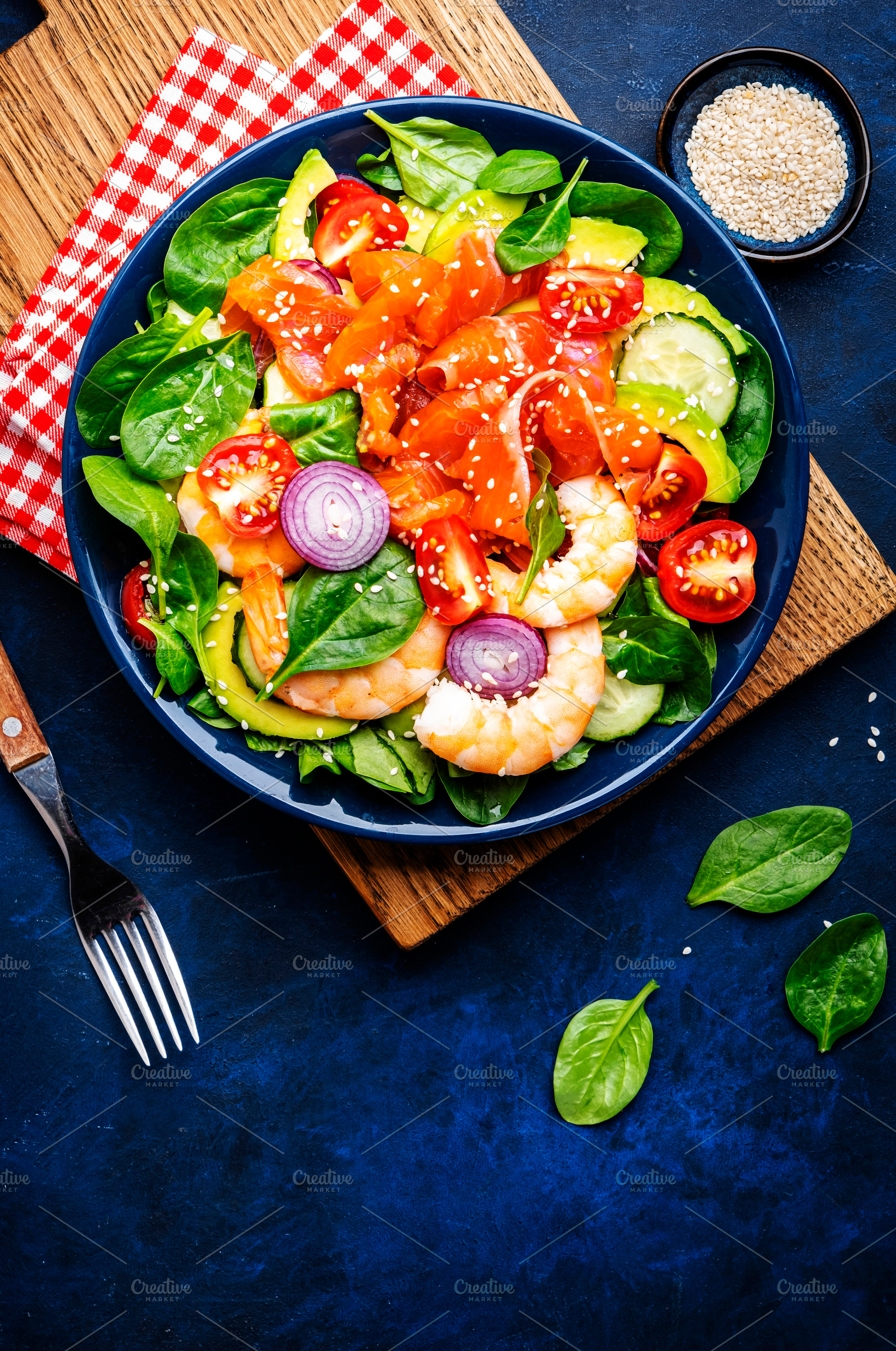 Fresh salad for keto diet with salmon, avocado, spinach, cucumbe, a Food & Drink Photo by 5PH