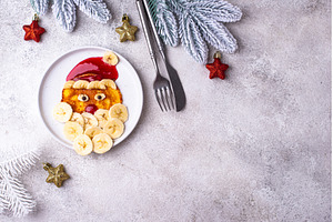 Pancakes in the shape of Santa Claus, a Holiday Photo by Yulia Furman