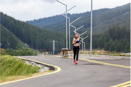 Young slim woman running on the road, a Sports & Recreation Photo by serkum