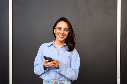 Woman use smartphone isolated on black, a Person Photo by andreonegin market