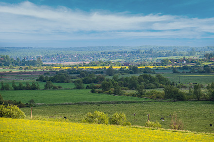 Spring countryside view with rapeseed yellow blooming fields, gr, a Nature Photo by YuriyB