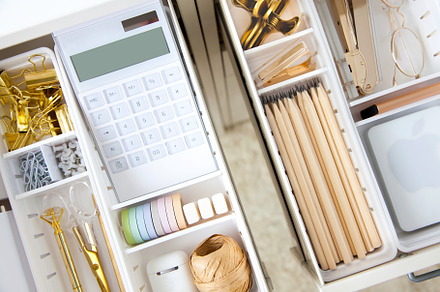 Female white workplace. A method for storing stationery neatly.