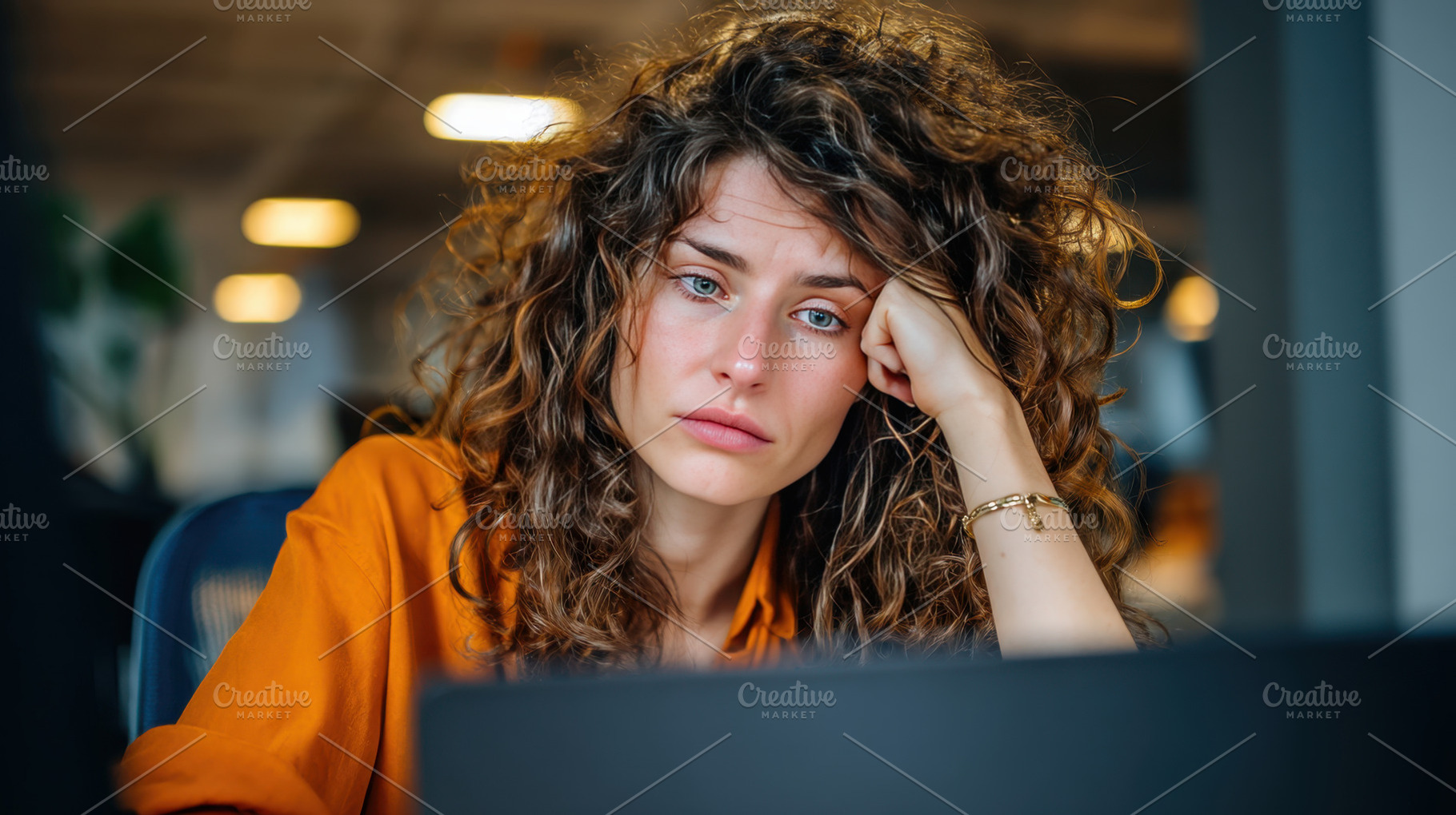 Woman with curly hair at work desk, a Photo by Beautiful things