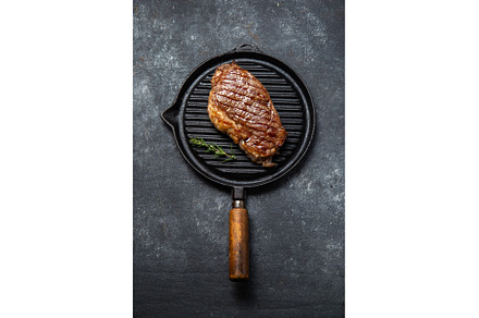 Fried strip loin steak on vintage, a Food & Drink Photo by LARISA BLINOVA