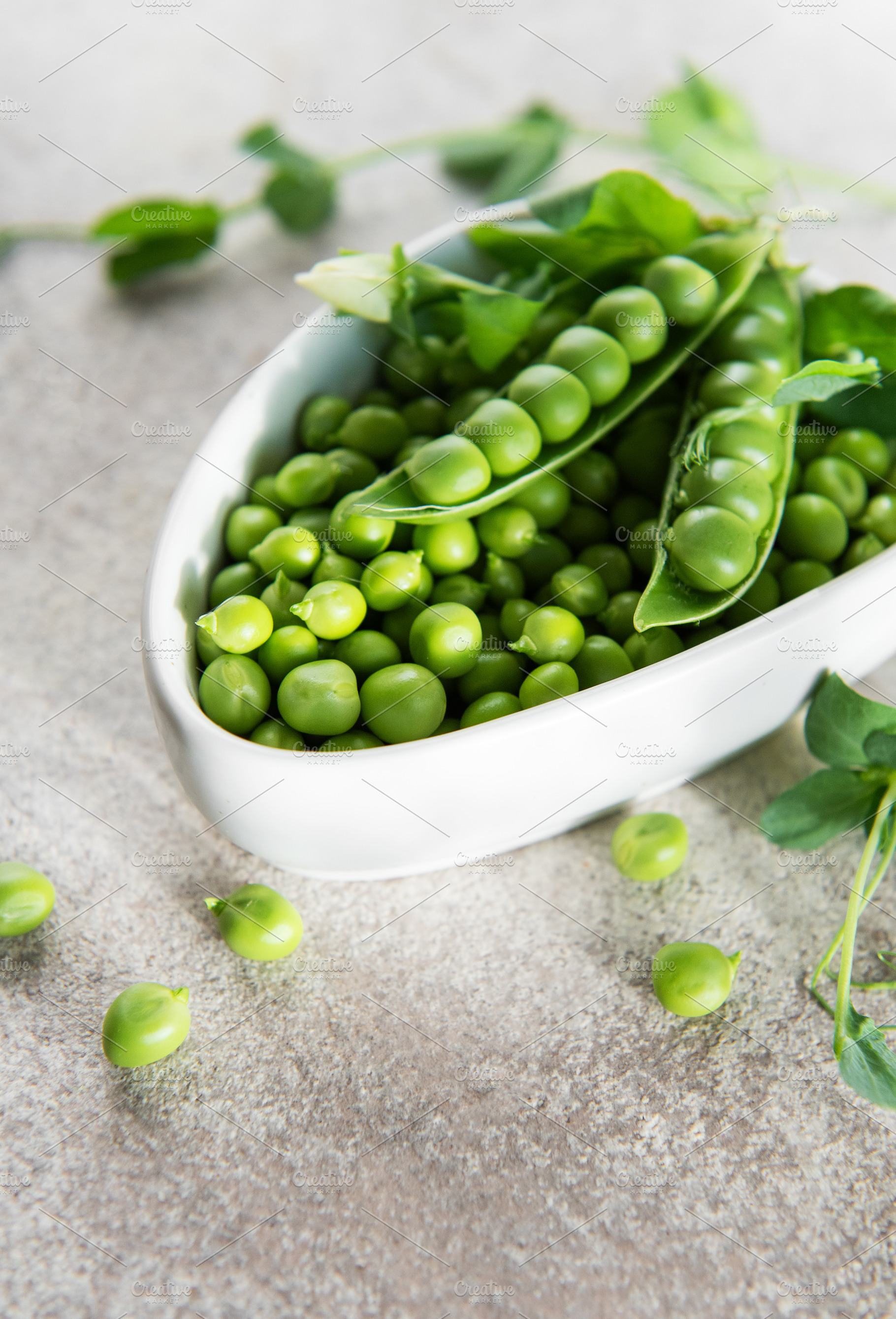 Fresh green peas in bowl representing healthy eating, a Food & Drink Photo by Olena Rudo