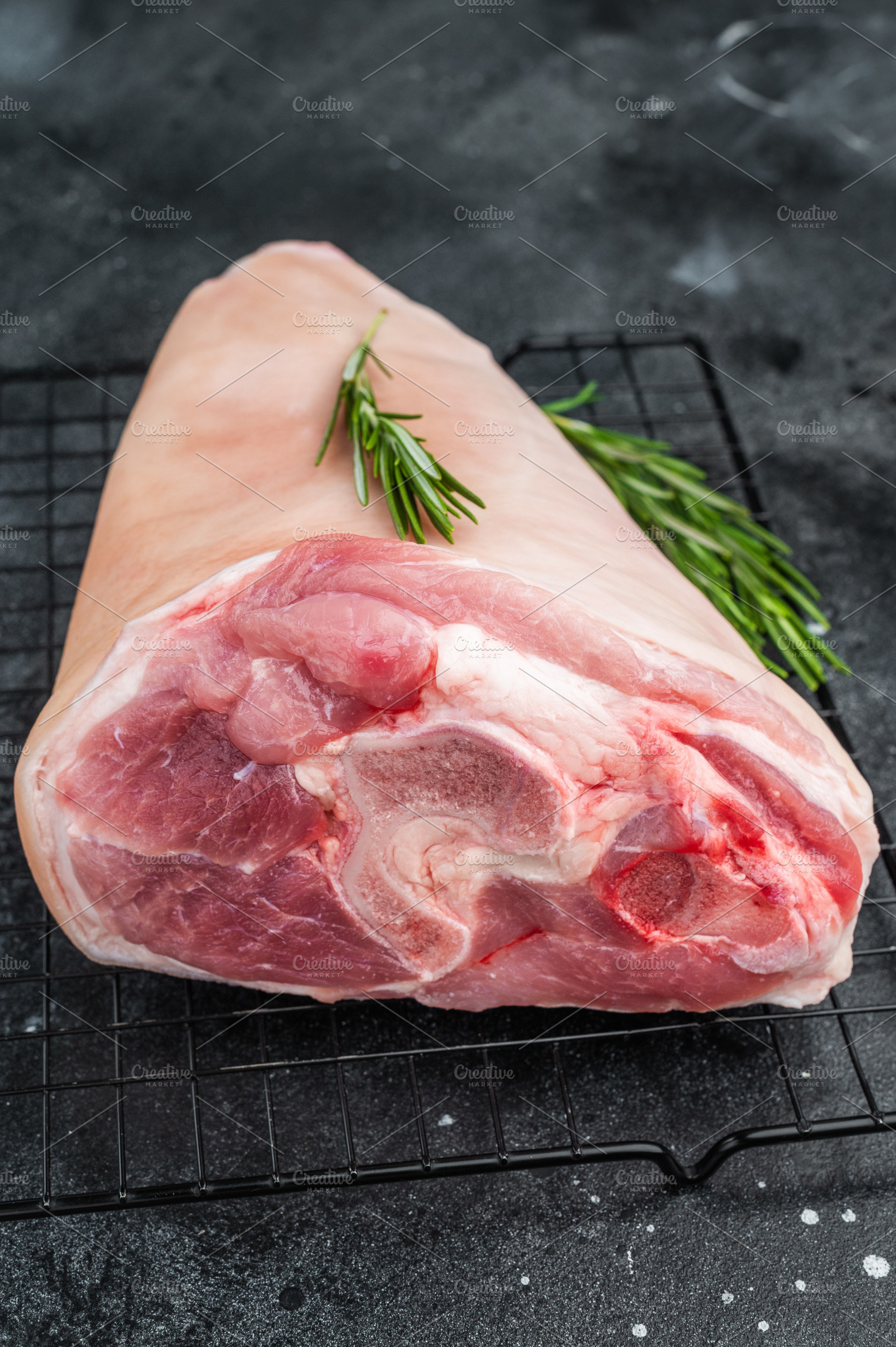 Fresh pork shank hock placed on grill rack with rosemary and vin, a Food & Drink Photo by composter-box@mail.ru
