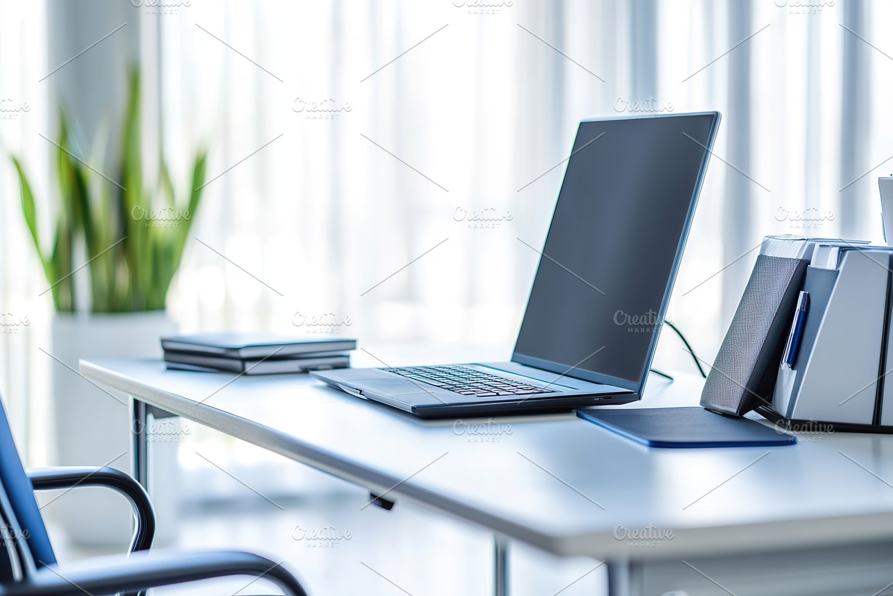 Organized modern office workspace with laptop and armchair, a Photo by AlyaAnd