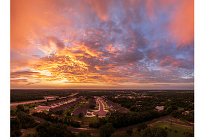 Dramatic sunset seen from drone over, a Nature Photo by Backyard Stock