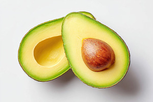 Ripe green avocado on white background, a Food & Drink Photo by AlyaAnd
