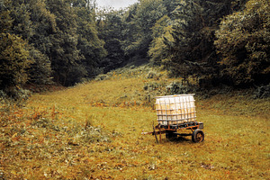 Water tank in forest clearing, an Industrial Photo by SkyNext