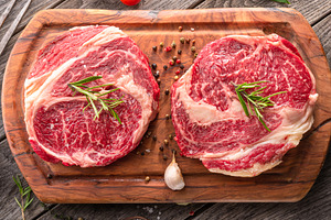 Raw beef steaks with herbs and spice, a Food & Drink Photo by Volff