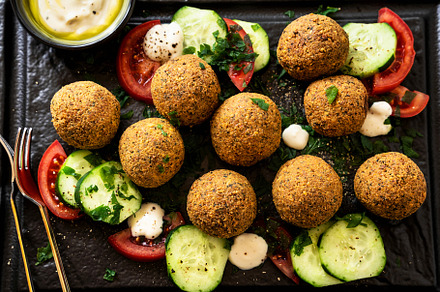 fried in oil falafel with cucumber-tomato salad and yoghurt with, a Food & Drink Photo by IriGri