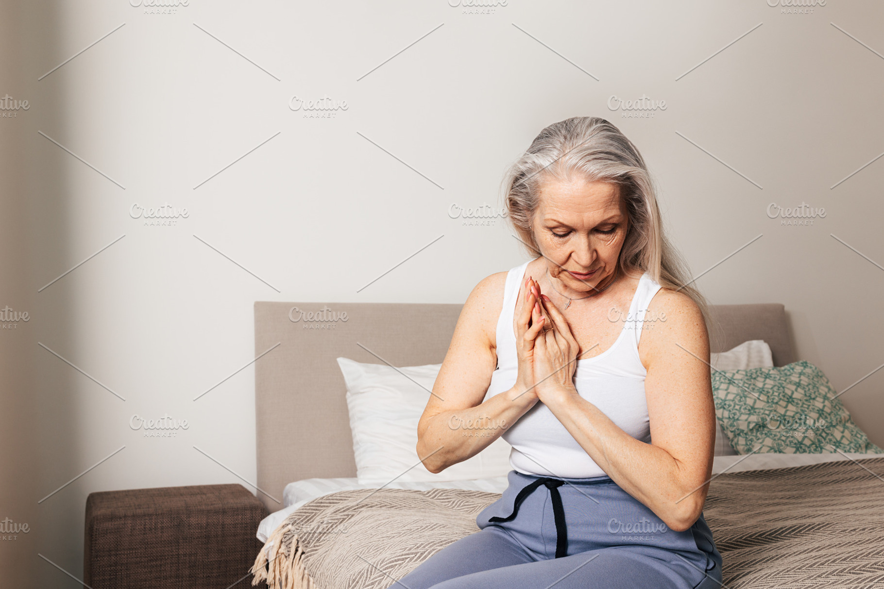 Senior woman with grey hair, a Person Photo by Artem Varnitsin
