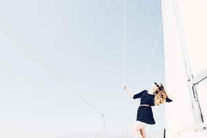 Girl on sailing boat featuring active, adventure, and boating