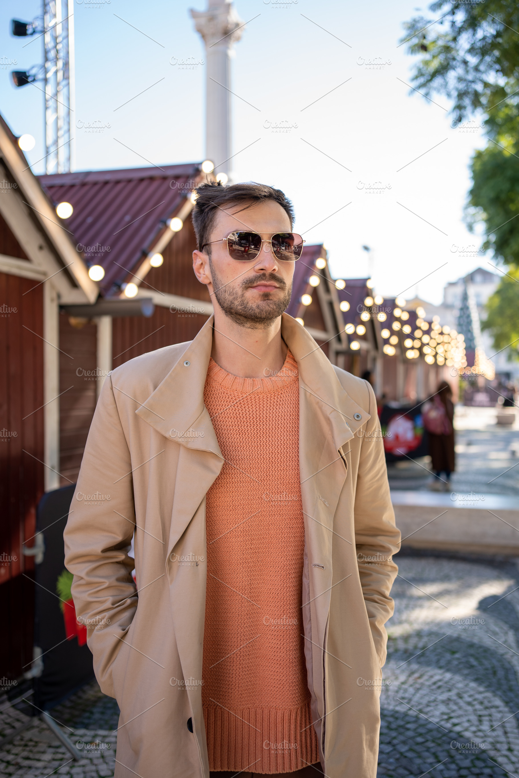 Man wearing sunglasses standing in front of decorated house, a Person Photo by andreonegin market