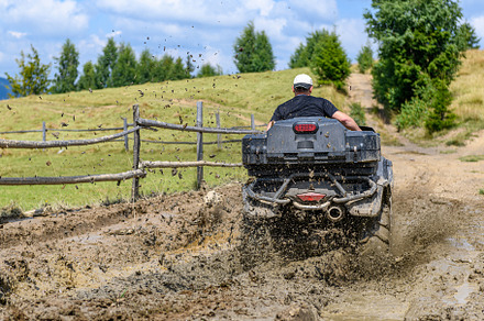 ATV racing on dirt track at summer mountain, a Transportation Photo by Byrdyak