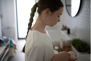 Teenager treating acne, taking care, a Beauty & Fashion Photo by HalfPoint
