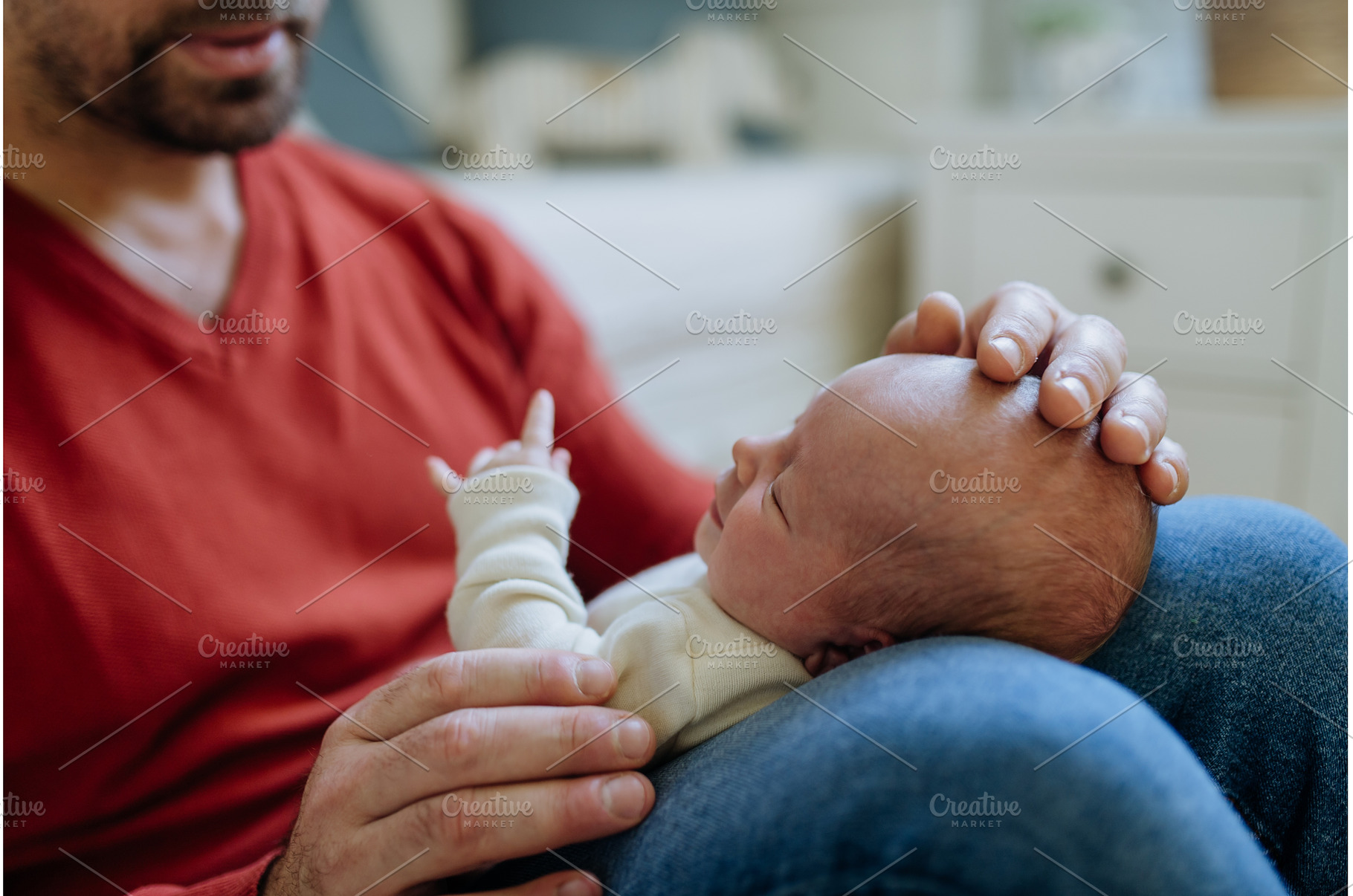 Close-up of father holding his, a Person Photo by HalfPoint