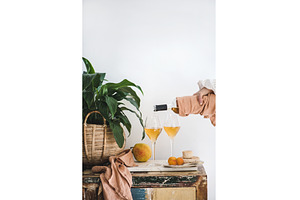Female hand pouring Orange or Amber