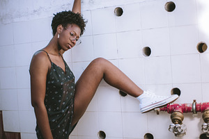 Woman on Red Pipe by Tile Wall, a Person Photo by SkyNext