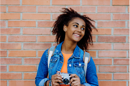Multiracial girl standing in front, a Person Photo by HalfPoint