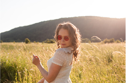 The joyful young woman in sunglasses, a Person Photo by oksix