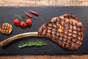 Grilled delicious tomahawk steak, a Food & Drink Photo by Volff