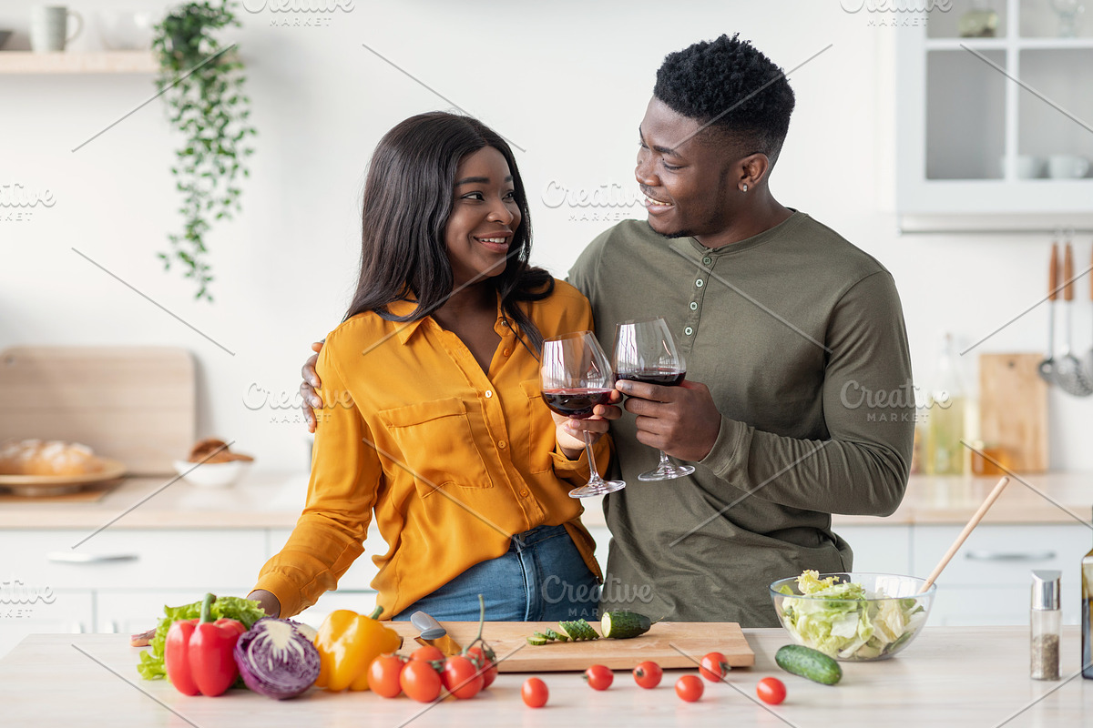 Cheers For Us. Romantic Black Couple Drinking Red Wine In Kitchen, a Photo by Prostock-Studio (Photo 4 of 5)
