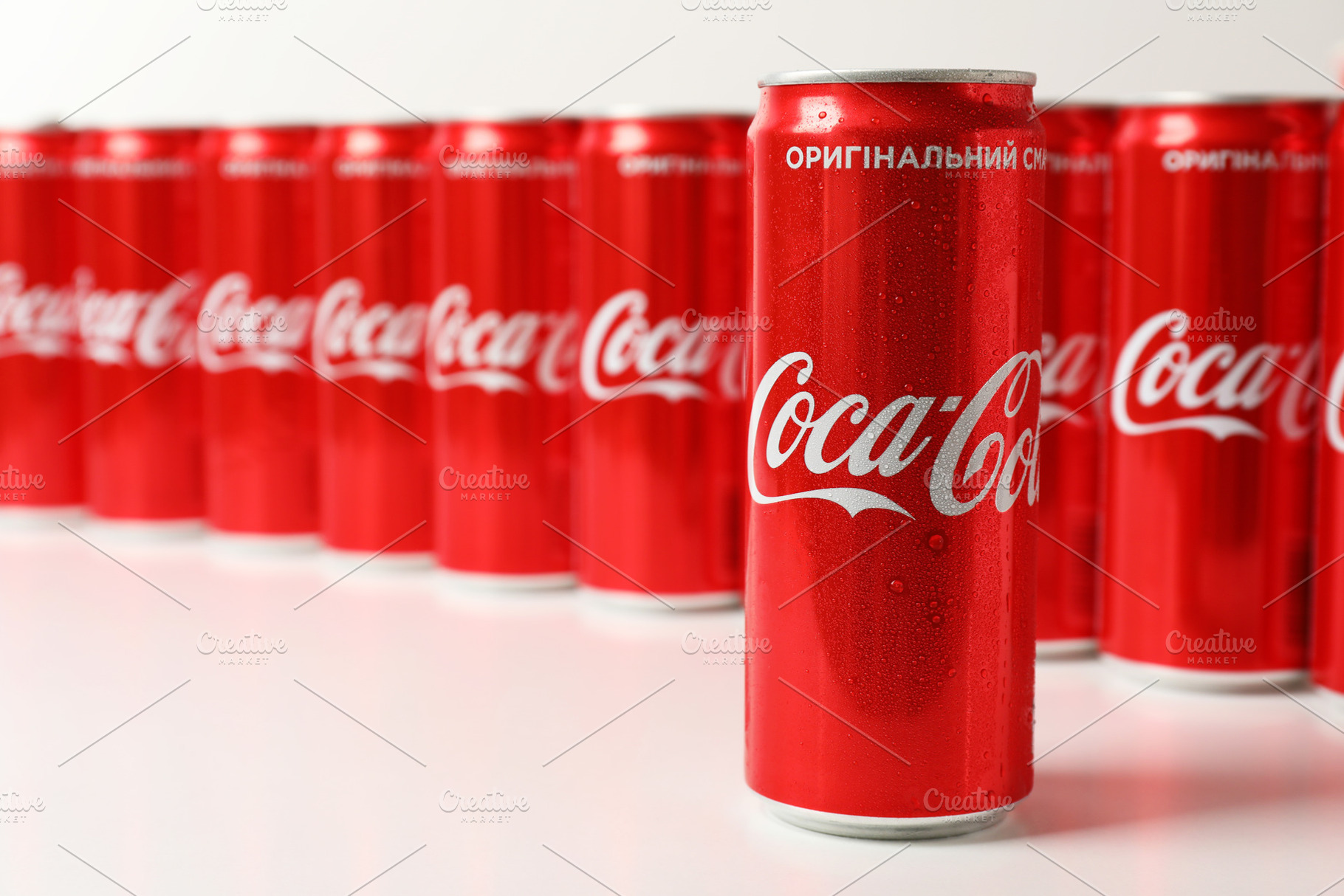 Odessa, Ukraine - September 23, 2021: Coca - Cola cans on white, a Food & Drink Photo by AtlasStudio PRO