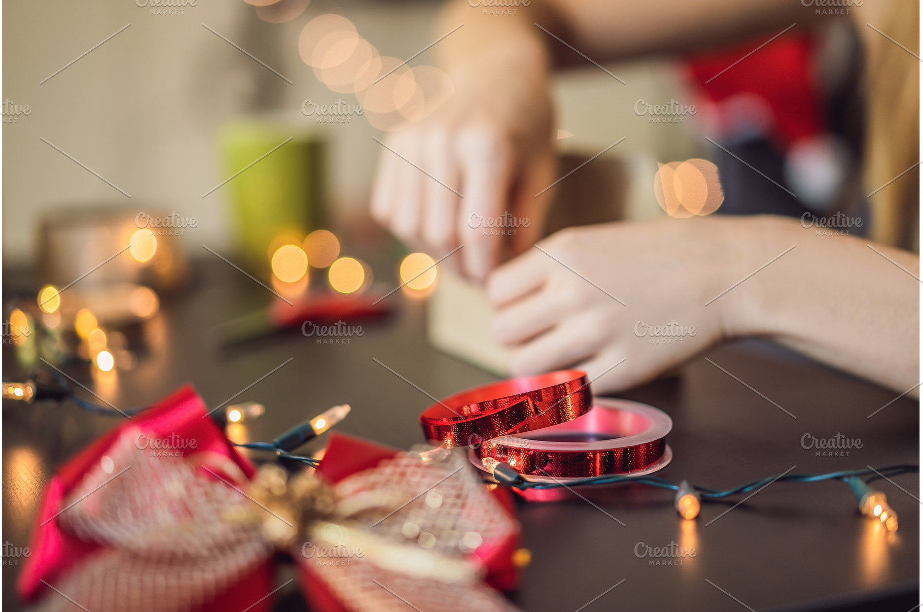Young woman is packing presents, a Holiday Photo by Elizaveta Galitskaya