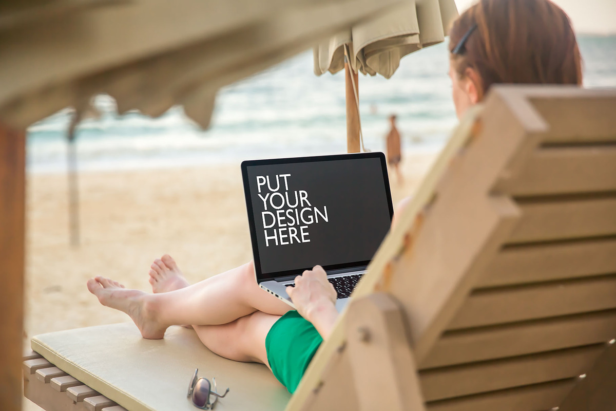 Girl on the Beach with Laptop, a Mac Mockup by UI Kitchen (Photo 2 of 6)