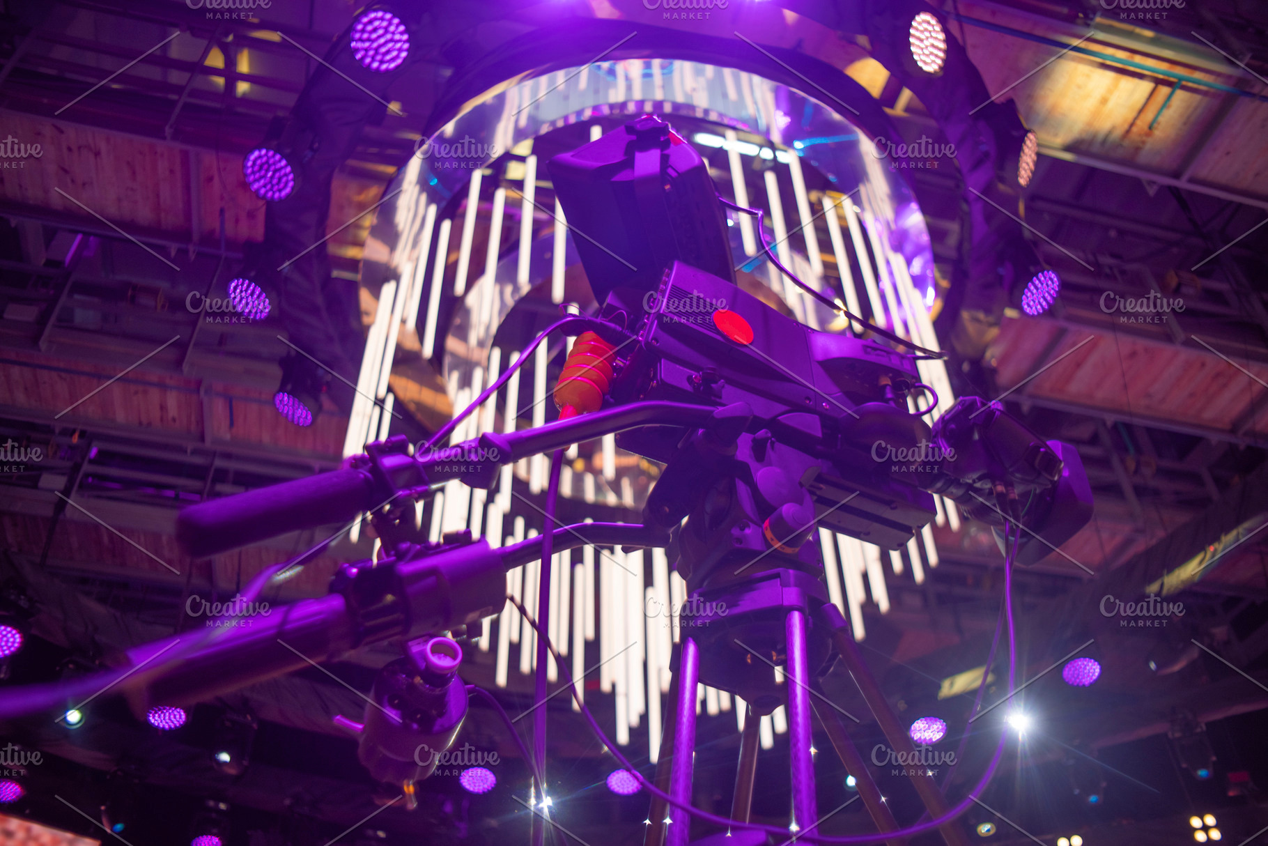 Professional broadcasting video camera on tripod with purple neo, a Photo by Pictures for you!!!!!!!!!