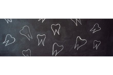 Teeth drawn in chalk on a black, a Health & Medical Photo by Elizaveta Galitskaya