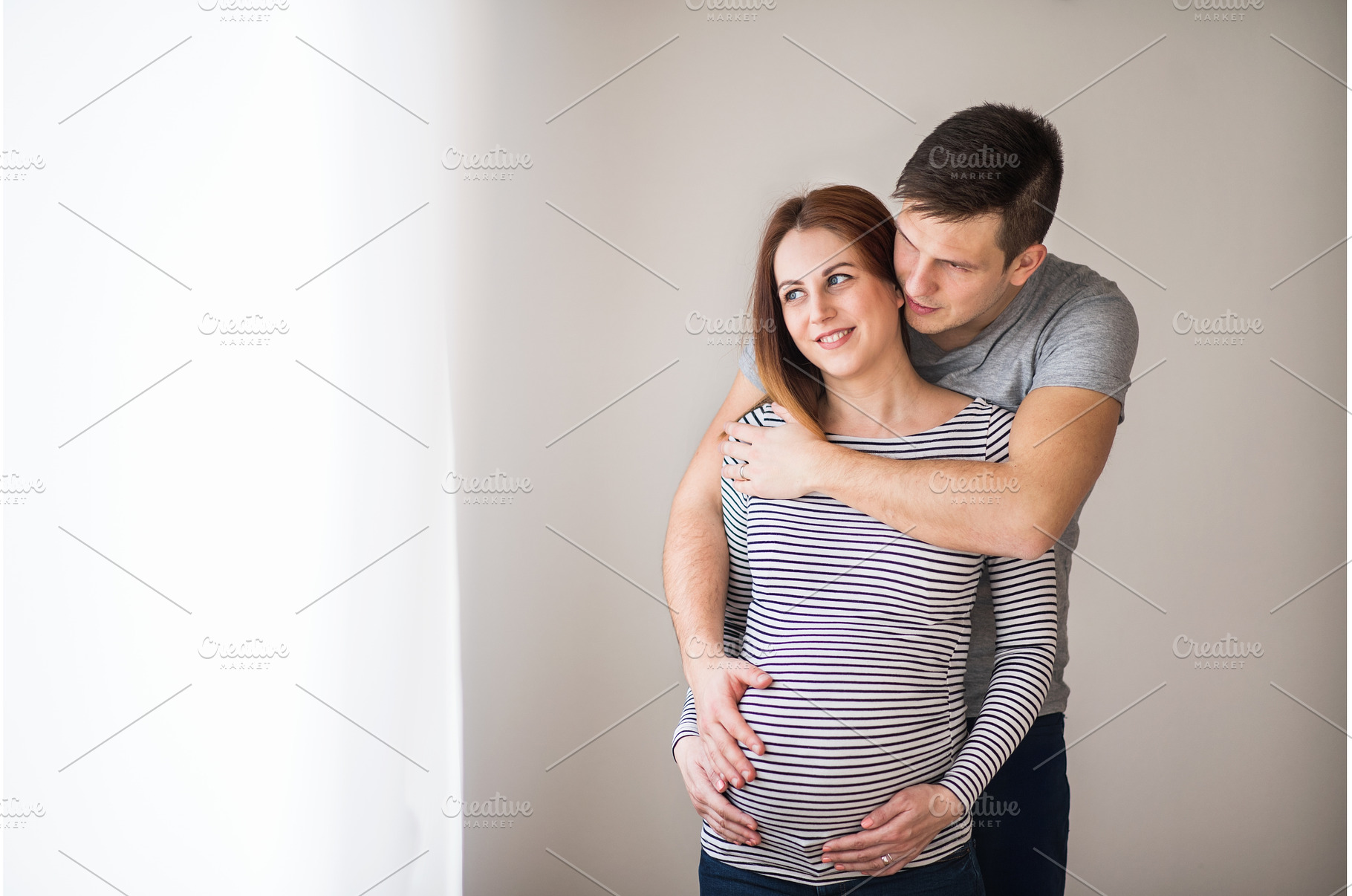 Pregnant woman and her partner, a Person Photo by HalfPoint