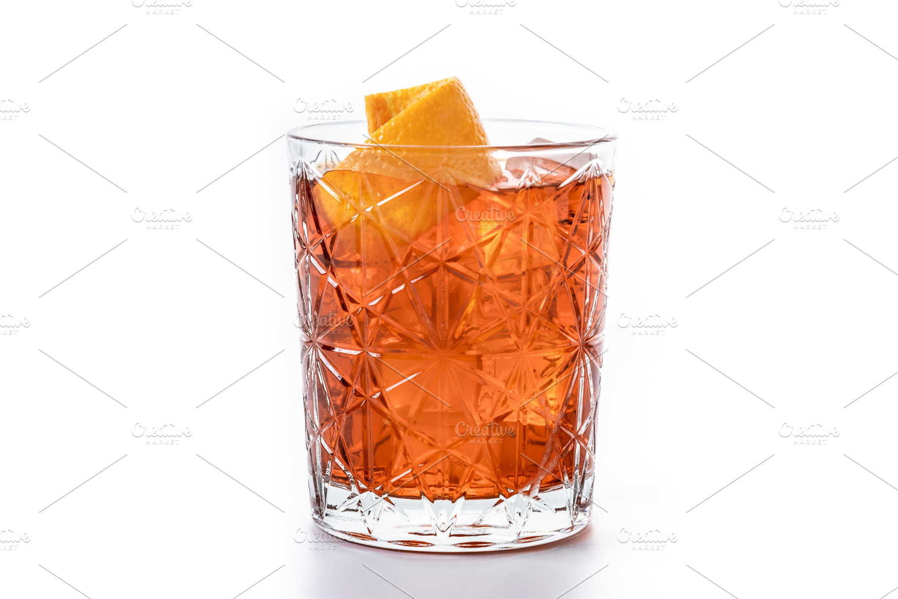 Americano cocktail garnished with twist orange isolated on white, a Food & Drink Photo by etorres69