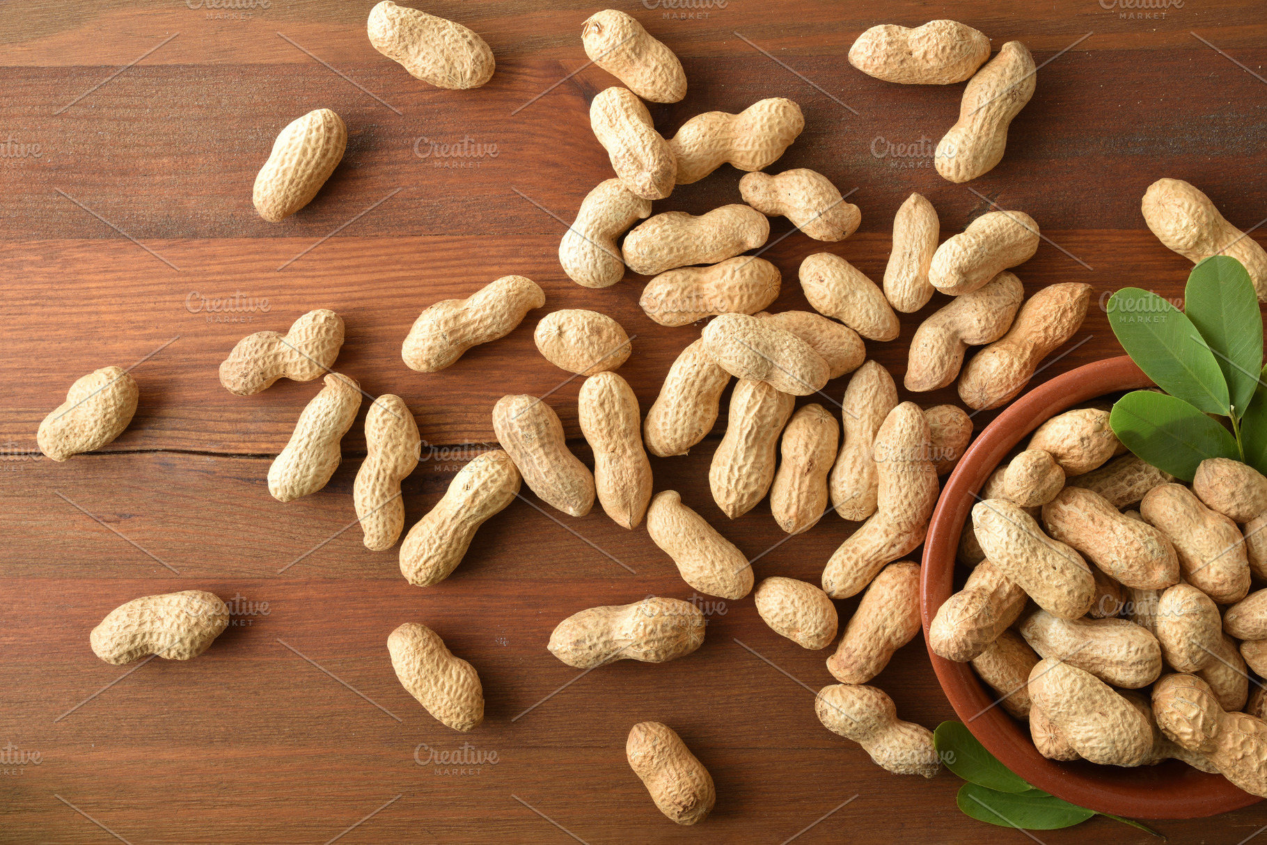 Peanuts with skin on a rustic wooden table, a Food & Drink Photo by Davizro's Market