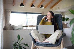 Female freelancer working from home, a Person Photo by HalfPoint