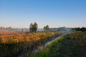 Foggy morning landscape over stream and wild meadow at sunrise. Scenic countrys, a Nature Photo by Rohan Photography