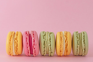 Pastel macarons on pink background