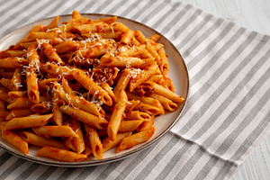 Homemade Pasta Bolognese with Cheese on a Plate, side view. Copy, a Food & Drink Photo by LiudmylaChuhunova