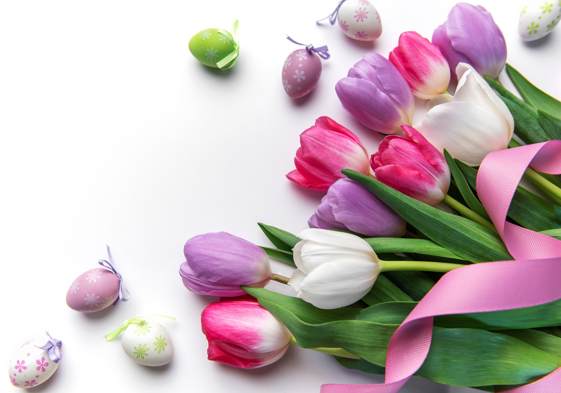 Easter spring tulips with decorative eggs and pink ribbon, a Holiday ...