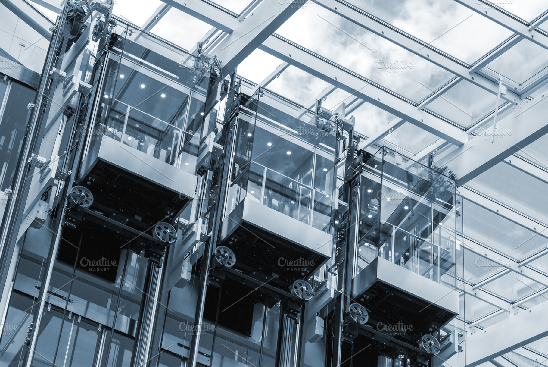 Elevators in a business center, an Architecture Photo by BOOCYS
