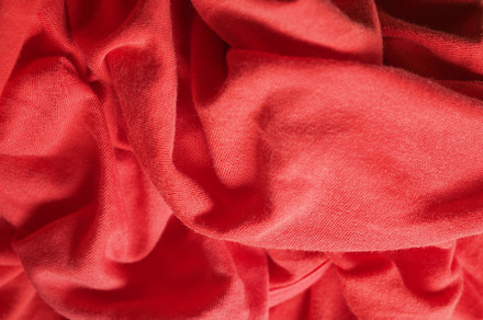 crumpled red fabric texture background, a Background Photo by WorldPhotos