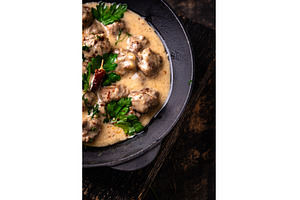 Meatballs in sour cream sauce in a, a Food & Drink Photo by Yulia Furman