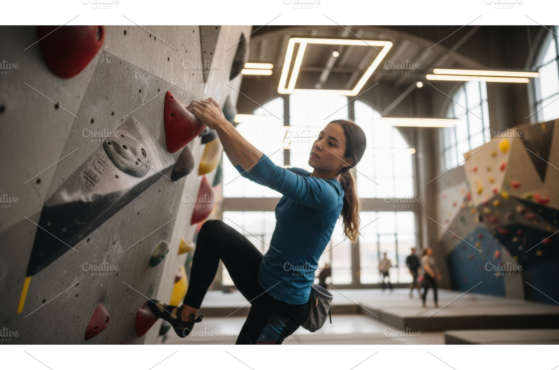 Woman indoor rock climber in a blue, a Sports & Recreation Photo by Igor Tichonow